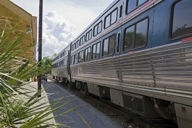 a passenger train at a railroad station
