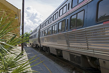 a passenger train at a railroad station